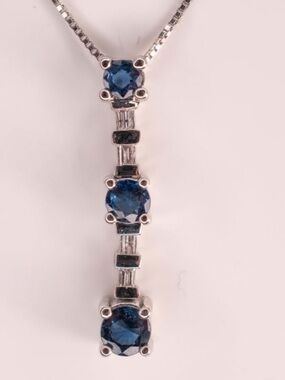 14k white gold and sapphire and diamond pendant on white gold chain.